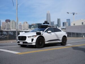 Waymo Jaguar I-PACE robotaxi driving in San Francisco with no one in the driver's seat